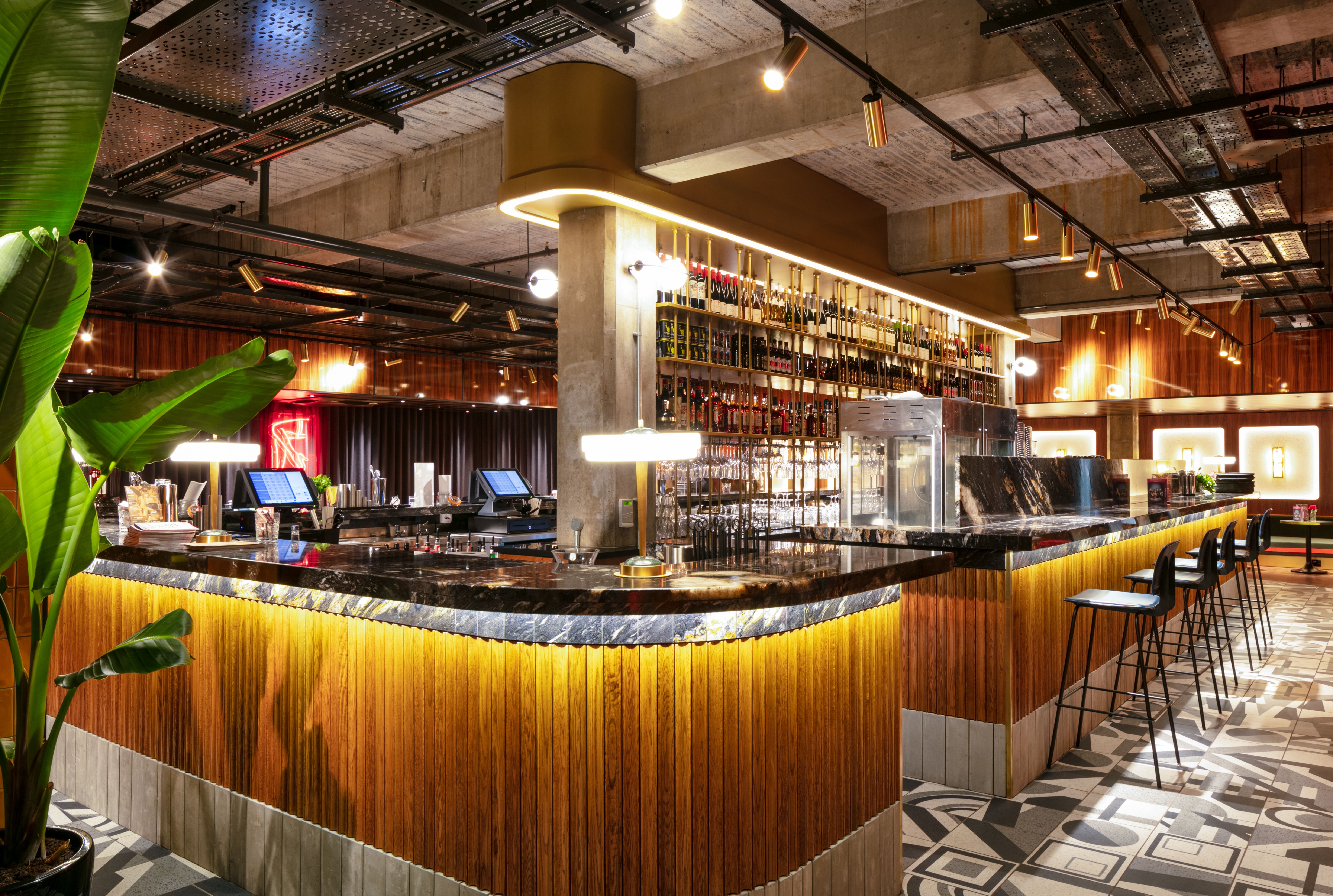 A luxurious yellow looking bar inside Everyman cinema.
